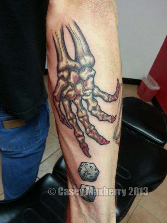 Skeleton-hand-rolling-dice