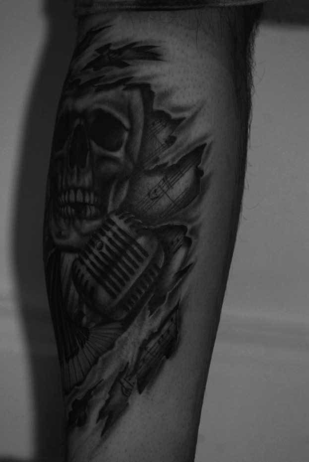 Skull-microphone-torn-skin-rosemary-mckevitt-tattoo-ireland