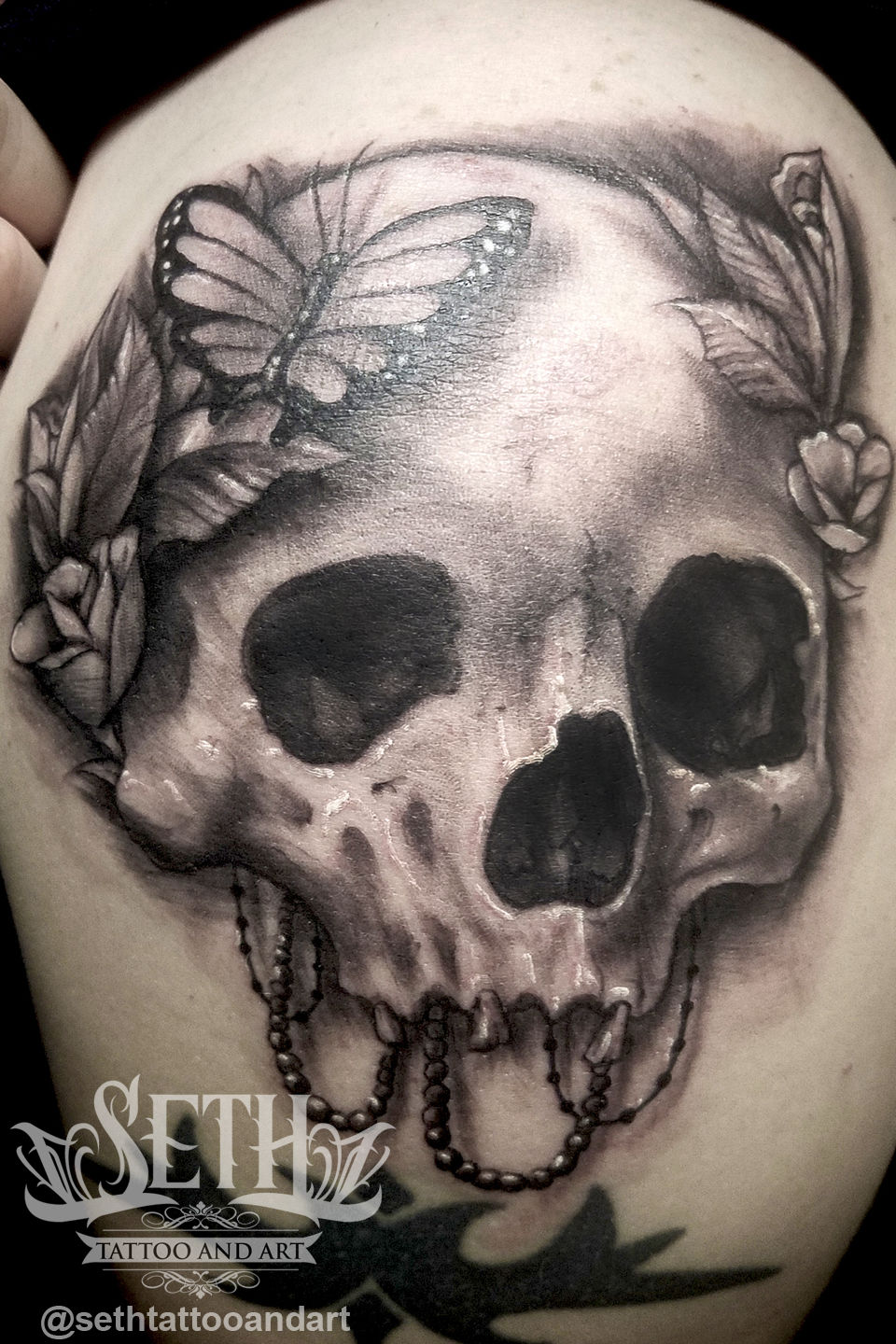Skull_tattoo__ink_inked_tattooed_tattoos__realistic_realism_real_human_skull_realistic_skull_tattoo_flowers_flower_tattoo_foliage__seth_michael__art_butterfly_black_and_grey_greywash__seth_tattoo_and_art