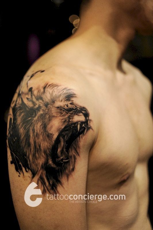 Roaring-lion-water-brush-detailed-portrait---upper-arm-black-and-gray-body-art---the-tattoo-concierge---global-service-network