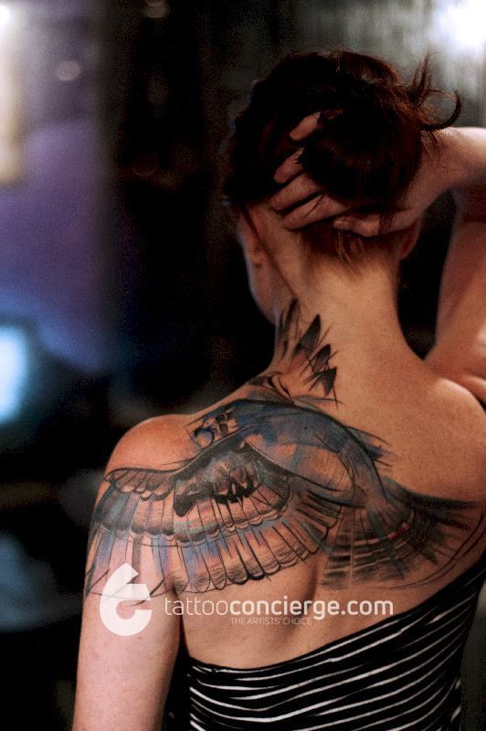 Ink-brush-watercolor-and-fine-line-sketch-bird-of-pray-body-art---upper-torso-placement---the-tattoo-concierge---global-platform